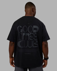 Man wearing Variation Heavyweight FLXCotton Oversized Tee - Black-Black | Model:Sam | Size:L