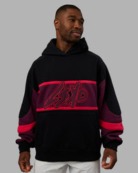 Man wearing Vibe Oversized Unisex Hoodie - Black-Cherry Lacquer | Model:Sam | Size:L | Thumbnail Index: 2