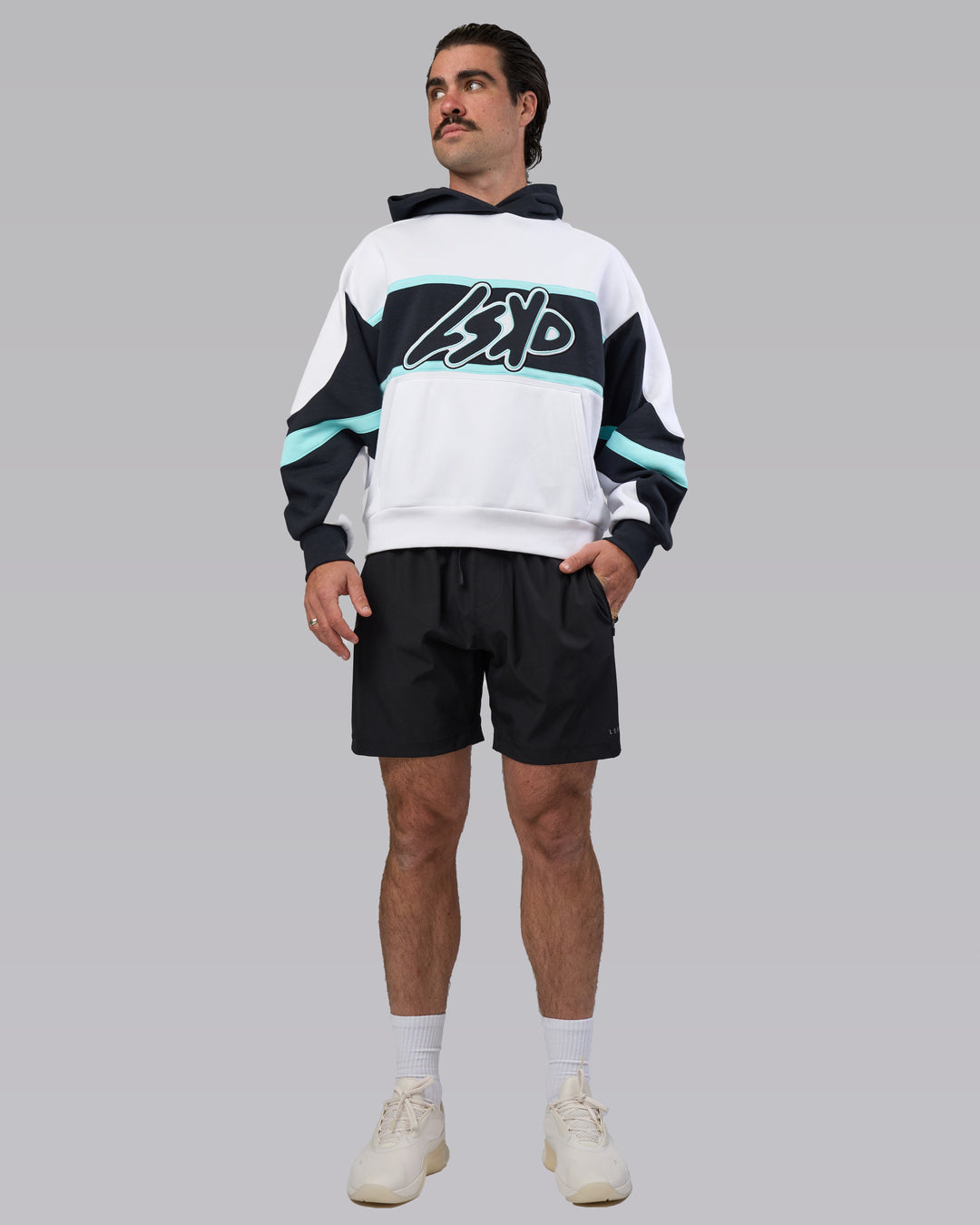 Man wearing Vibe Oversized Unisex Hoodie - White-Island Paradise | Model:Adam | Size:L