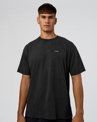 Man wearing We Love This  FLXCotton Oversized Tee - Black Washed-White | Model:Jackson | Size:L