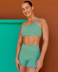 Woman wearing Abs Ignite Sports Bra - Matcha Green | Model:Abbey | Size:M