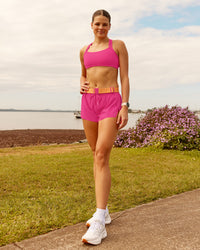 Woman wearing Accelerate 3" Running Short - Ultra Pink | Model:Phoebe | Size:M