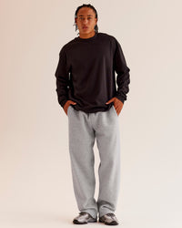 Man wearing AfterDark ZeroCrease Long Sleeve Tee - Black | Model:Malebo | Size:M