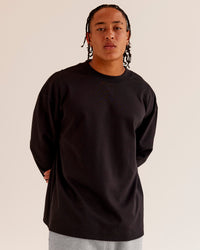Man wearing AfterDark ZeroCrease Long Sleeve Tee - Black | Model:Malebo | Size:M