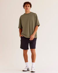 Man wearing AfterDark ZeroCrease Oversized Tee - Walnut Grey | Model:Leandro | Size:M
