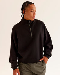 Man wearing AfterDark ZeroCrease Quarter Zip - Black | Model:Malebo | Size:M