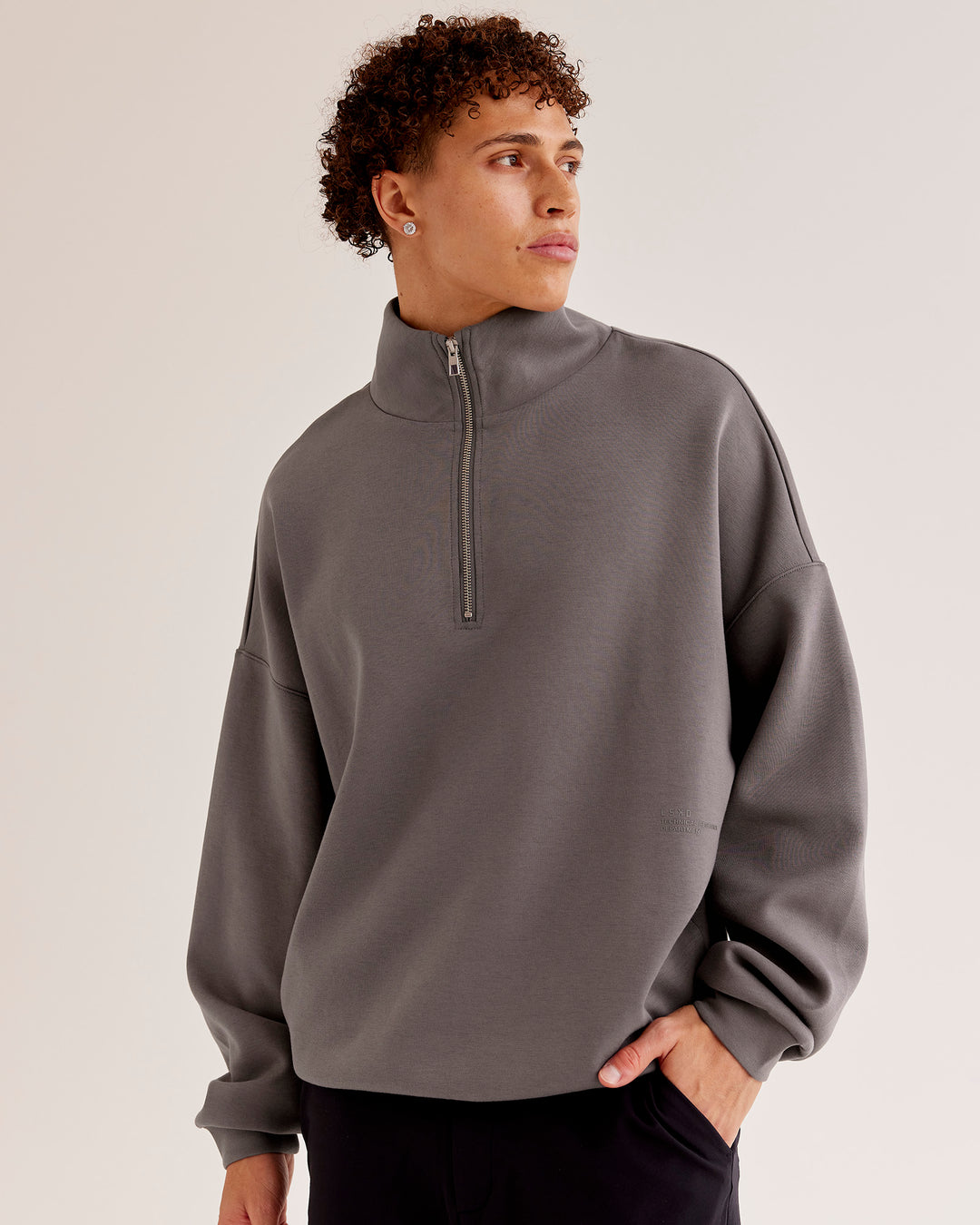 Man wearing AfterDark ZeroCrease Quarter Zip - Duskstone | Model:Leandro | Size:M