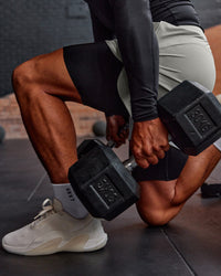 Man wearing BaseTech 8" Shorts - Black | Model:Daarian | Size:M