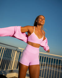 Woman wearing Blushing Sports Bra - Pink Rose-White | Model:Shayna | Size:M