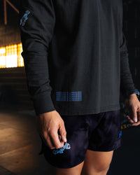 Man wearing Cali FLXCotton Oversized Long Sleeve Tee - Black Washed | Model:Moses | Size:M