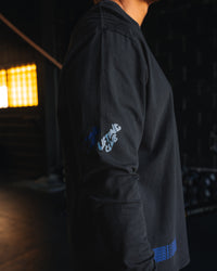 Man wearing Cali FLXCotton Oversized Long Sleeve Tee - Black Washed | Model:Moses | Size:M