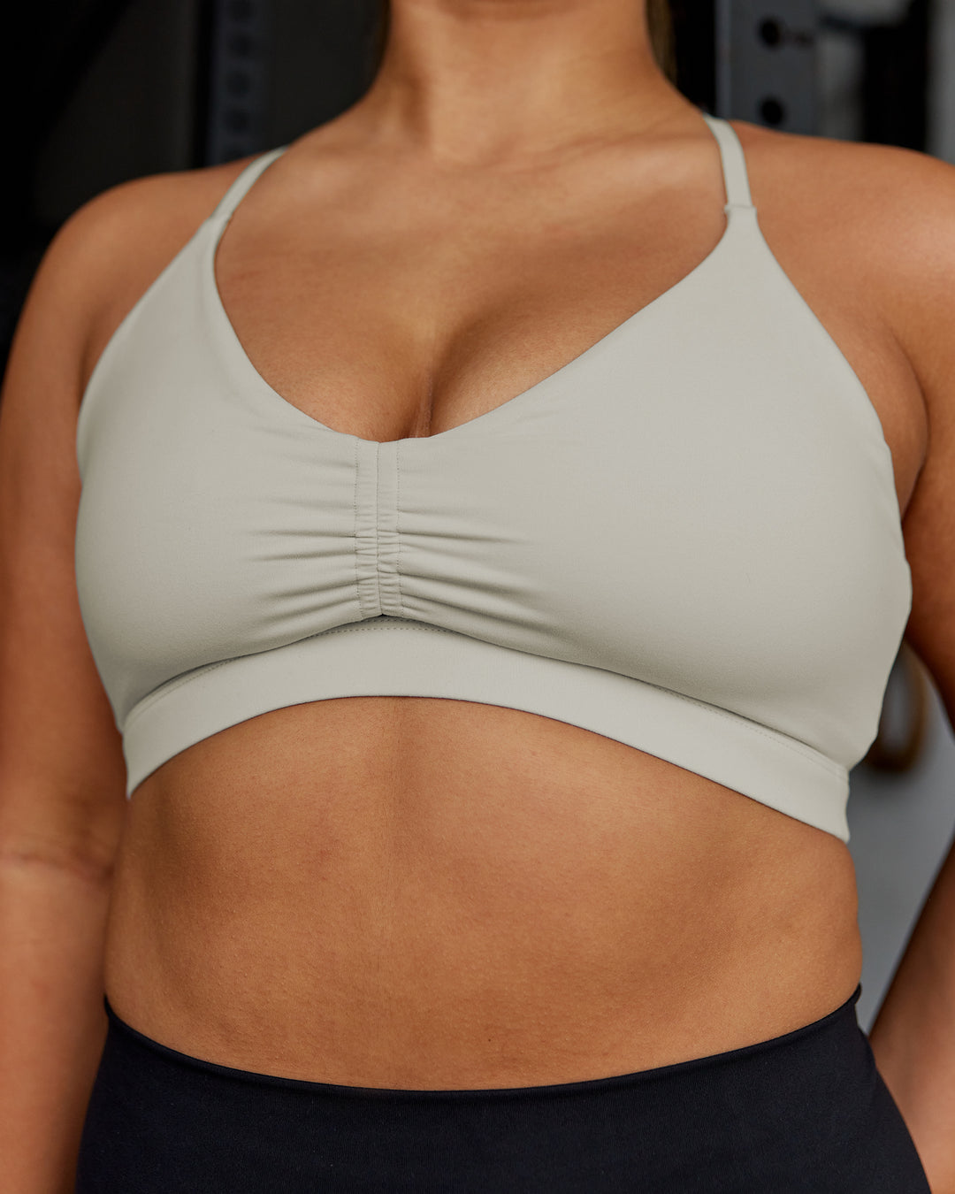 Woman wearing Essence Sports Bra - Shale Beige | Model:Gloria | Size:M