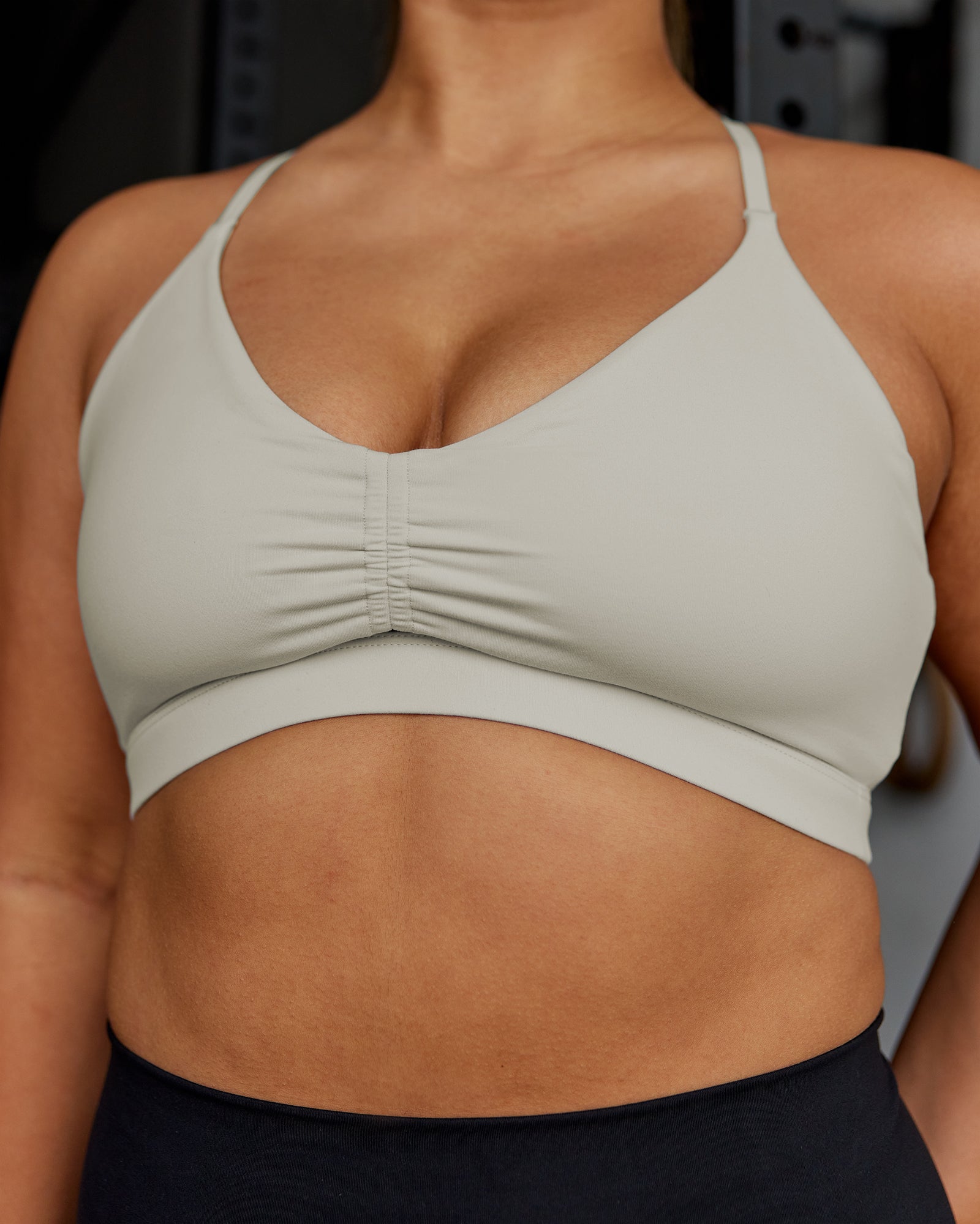 Woman wearing Essence Sports Bra - Shale Beige | Model:Gloria | Size:M