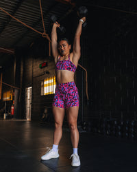 Woman wearing Fusion High-Rise 4" Short Pockets - Pink Luminous | Model:Teraipine | Size:M