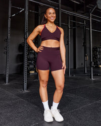 Woman wearing Fusion Jacquard High-Rise 6" Short Pockets - Cherry Lacquer | Model:Tyra | Size:M
