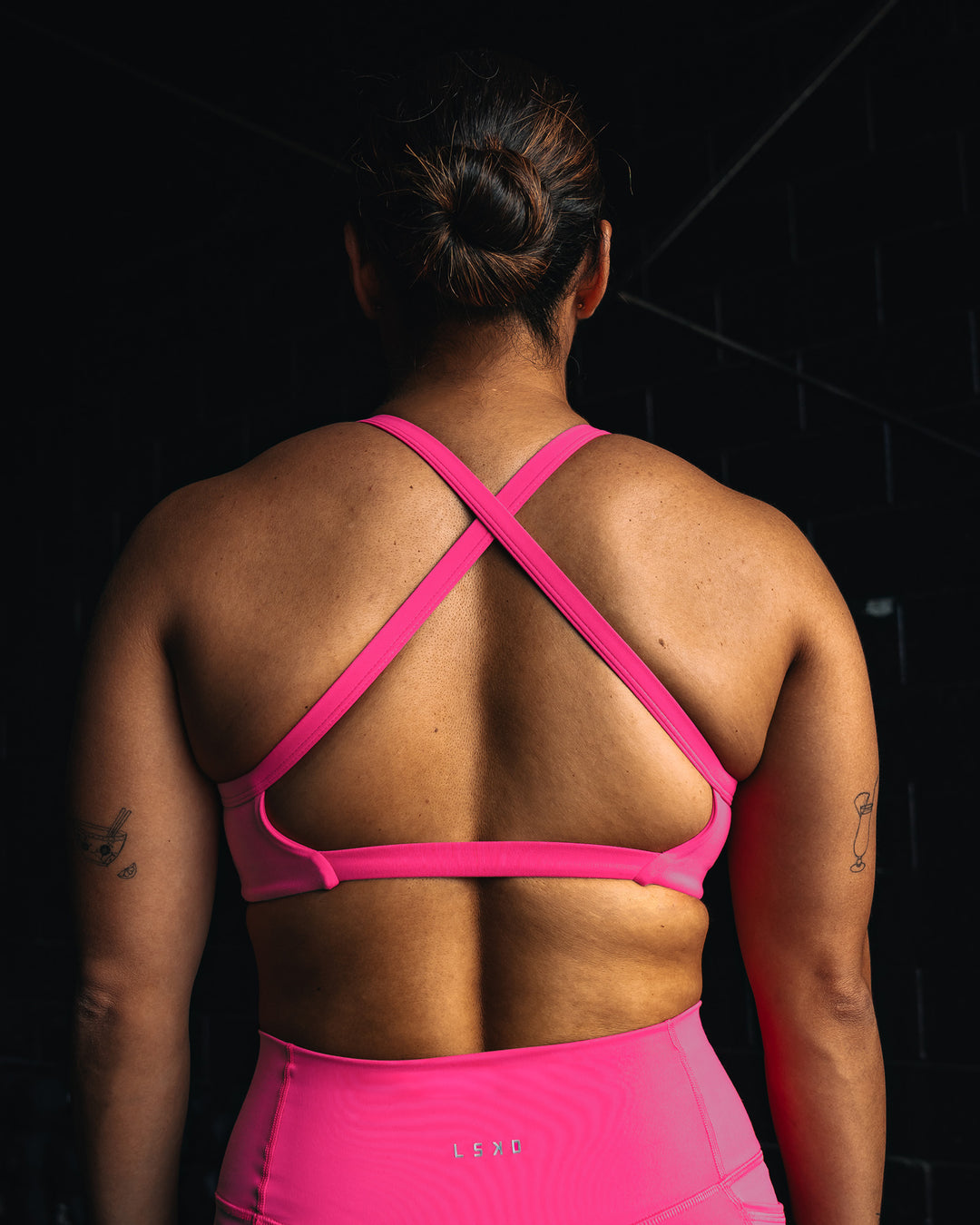 Woman wearing Inspired Sports Bra - Ultra Pink | Model:Tiare | Size:M