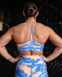 Woman wearing Lift High Neck Sports Bra - Apricot Mist | Model:Tiare | Size:M