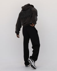 Man wearing Memory In Motion 500gsm Ultra Heavyweight Washed Hoodie - Charcoal Washed | Model:Okello | Size:M