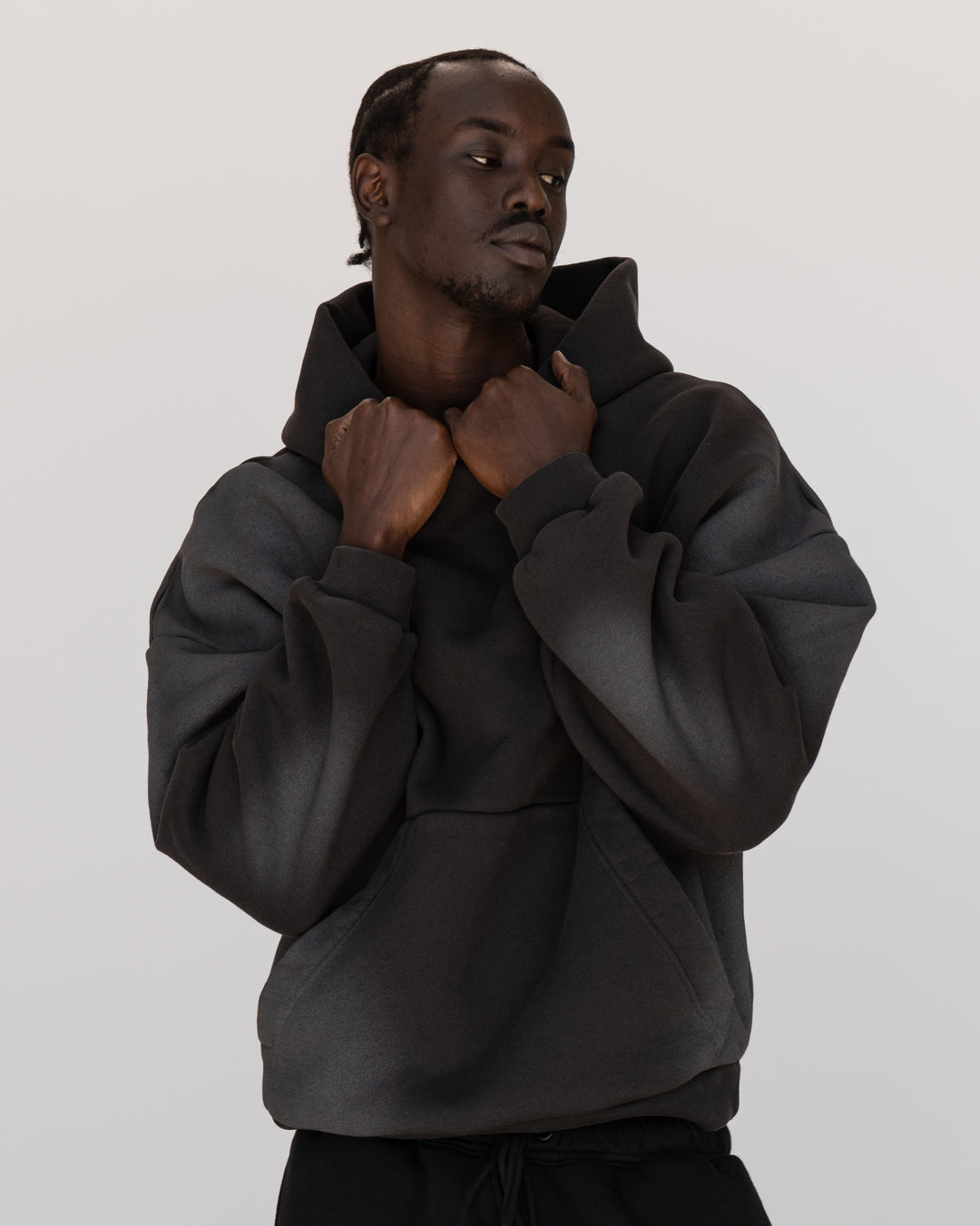 Man wearing Memory In Motion 500gsm Ultra Heavyweight Washed Hoodie - Charcoal Washed | Model:Okello | Size:M
