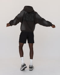 Man wearing Memory In Motion 500gsm Ultra Heavyweight Washed Hoodie - Charcoal Washed | Model:Okello | Size:M