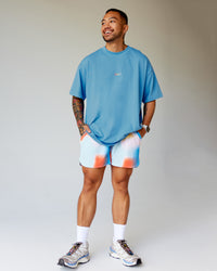 Man wearing Our Journey Heavyweight Oversized Tee - Azure Blue-Rainbow | Model:Justin | Size:M