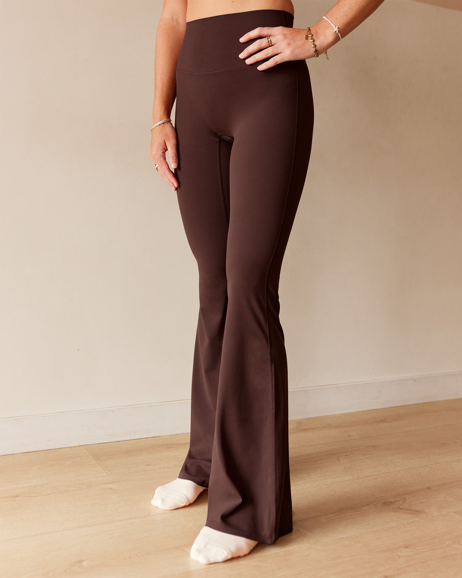 Woman wearing Peaches Elixir High-Rise Flared Pant - Hot Chocolate | Model:Dani | Size:M