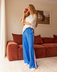 Woman wearing Peaches Track Pant - Palace Blue | Model:Tori | Size:M