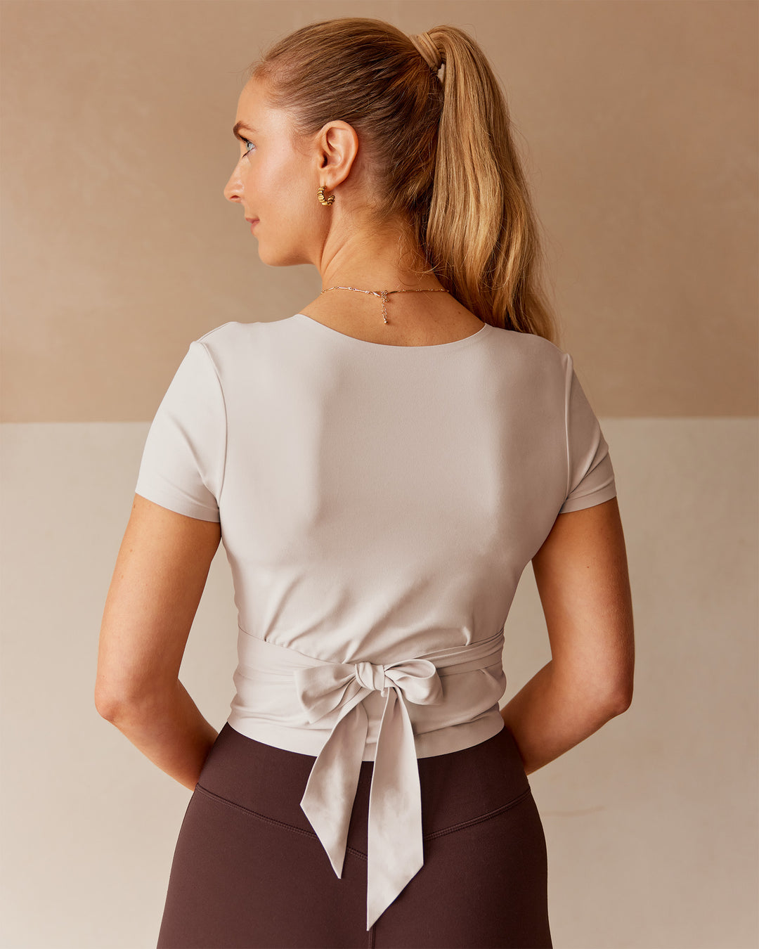 Woman wearing Peaches Wrap Cinch Top - Shale Beige | Model:Tori | Size:M