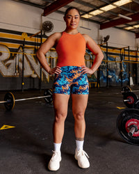 Woman wearing Power Performance Tank - Ultra Orange | Model:Vana | Size:M