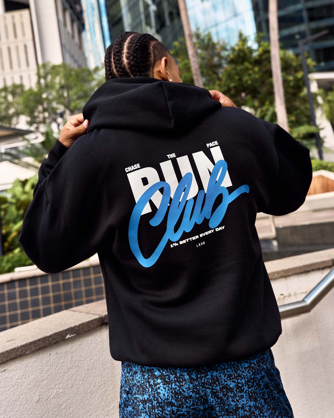 Man wearing Run Club Script Oversized Hoodie - Black-Palace Blue | Model:Malebo | Size:M