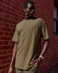 Man wearing Shadow Mode FLXCotton Oversized Tee - Walnut Grey Washed | Model:Mabyro | Size:M