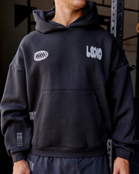 Man wearing Static Grit Unisex Boxy Hoodie - Black-Alloy | Model:Jaiden | Size:M