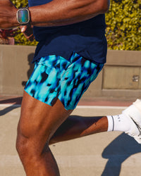Man wearing UltraAir 5" Lined Performance Short - Luminous | Model:Herve | Size:M