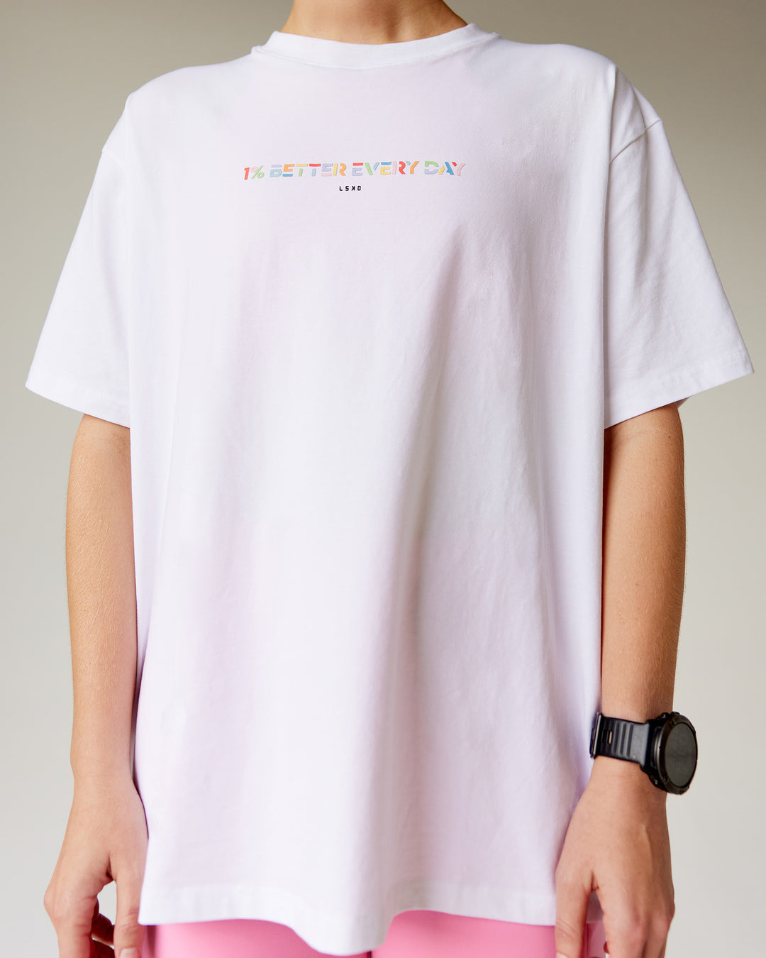 Woman wearing Unity Go-To FLX Cotton Tee - White-Rainbow | Model:Adi | Size:M