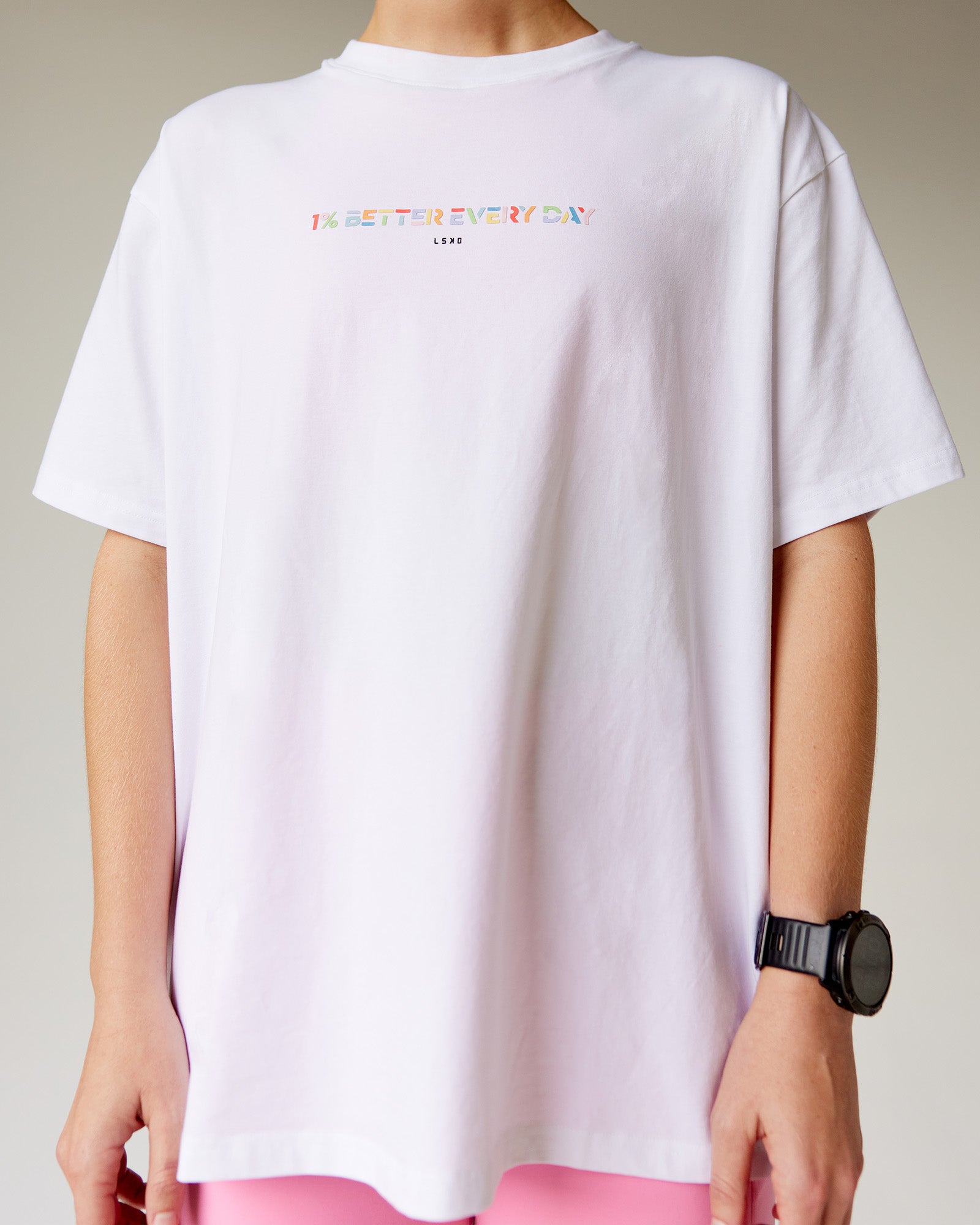 Woman wearing Unity Go-To FLX Cotton Tee - White-Rainbow | Model:Adi | Size:M