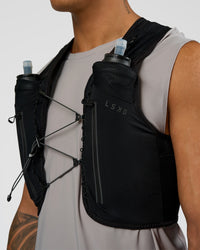 Woman wearing Pace Running Vest - Black-Reflective | Model:Daarian | Size:M/L