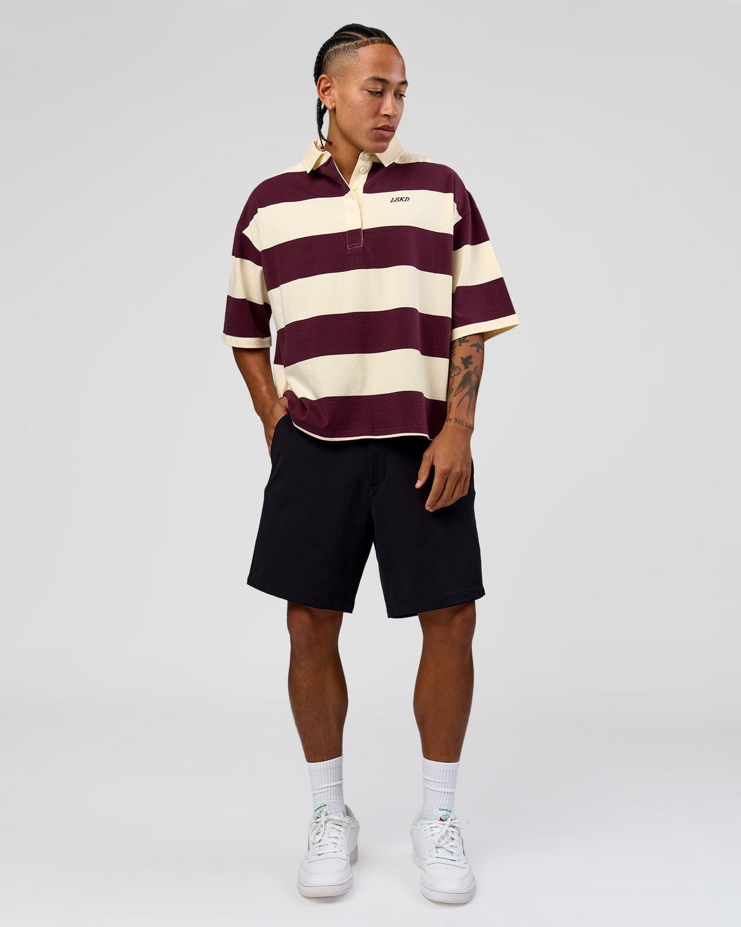 Man wearing Oversized Rugby Polo - Off White-Cherry | Model:Malebo | Size:M