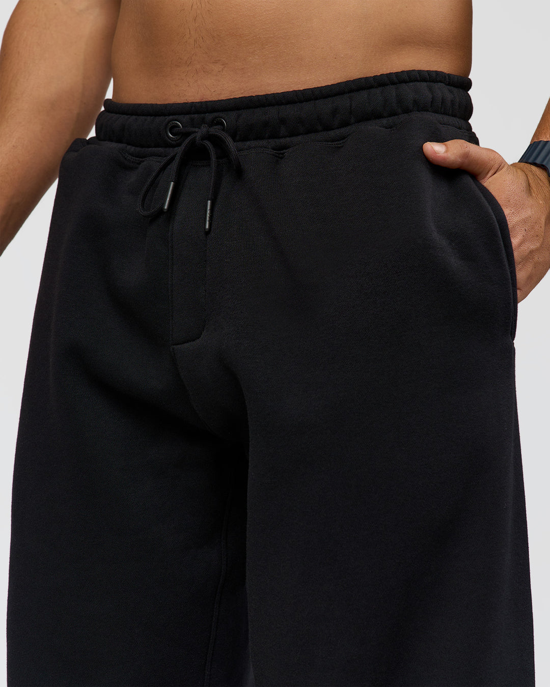 Man wearing Static Grit Baggy Track Pant - Black-Alloy | Model:Jaiden | Size:M
