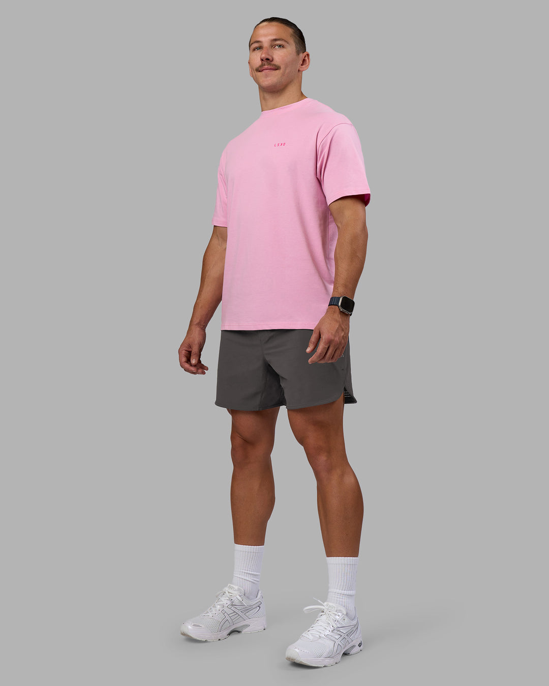 Man wearing 1% Better Value Series FLXCotton Tee Oversize - Bubblegum-Ultra Pink | Model:Jaiden | Size:M