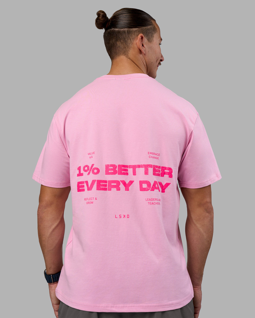 Man wearing 1% Better Value Series FLXCotton Tee Oversize - Bubblegum-Ultra Pink | Model:Jaiden | Size:M