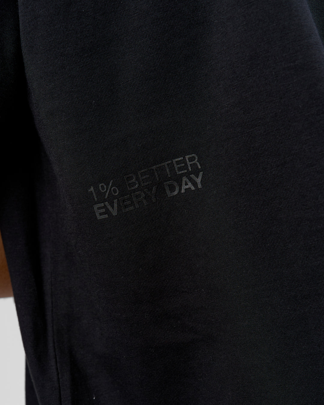 Man wearing 86 V-Neck Oversized Tee - Black-Black | Model:Leandro | Size:M
