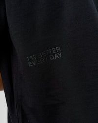 Man wearing 86 V-Neck Oversized Tee - Black-Black | Model:Leandro | Size:M