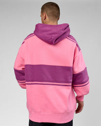 Man wearing A-Team Oversized Hoodie - Candy Pink-Boysenberry | Model:Arran | Size:M