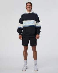 Man wearing A-Team Oversized Hoodie - Caviar-Open Air | Model:Konnor | Size:M