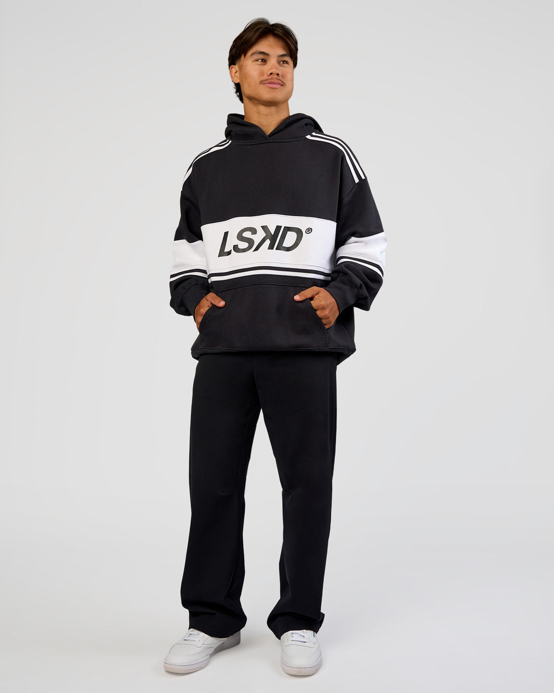 Man wearing A-Team Oversized Hoodie - Caviar-White | Model:George | Size:M