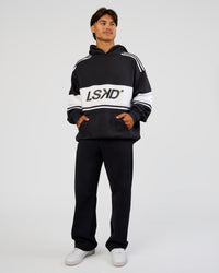 Man wearing A-Team Oversized Hoodie - Caviar-White | Model:George | Size:M