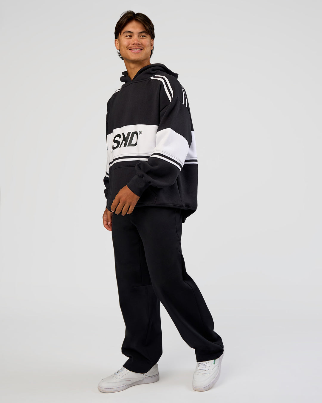 Man wearing A-Team Oversized Hoodie - Caviar-White | Model:George | Size:M