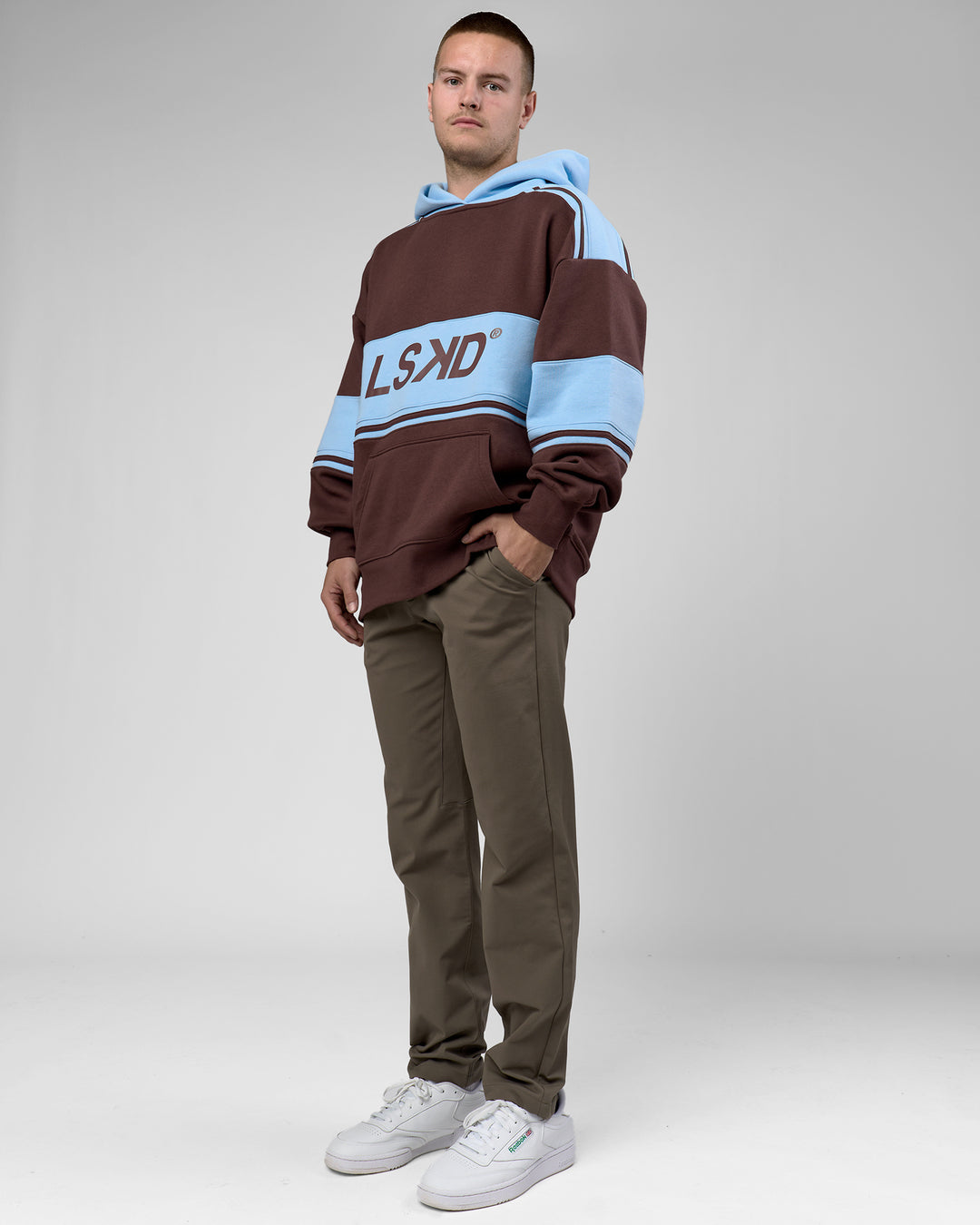 Man wearing A-Team Oversized Hoodie - Hot Chocolate-Open Air | Model:Arran | Size:M