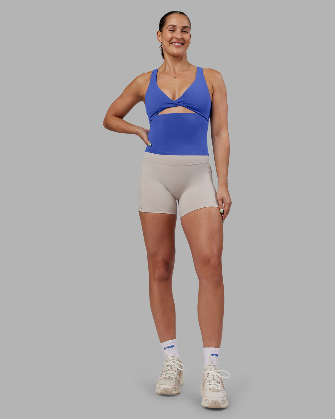Woman wearing Abs Agile Tank - Power Cobalt | Model:Abbey | Size:M
