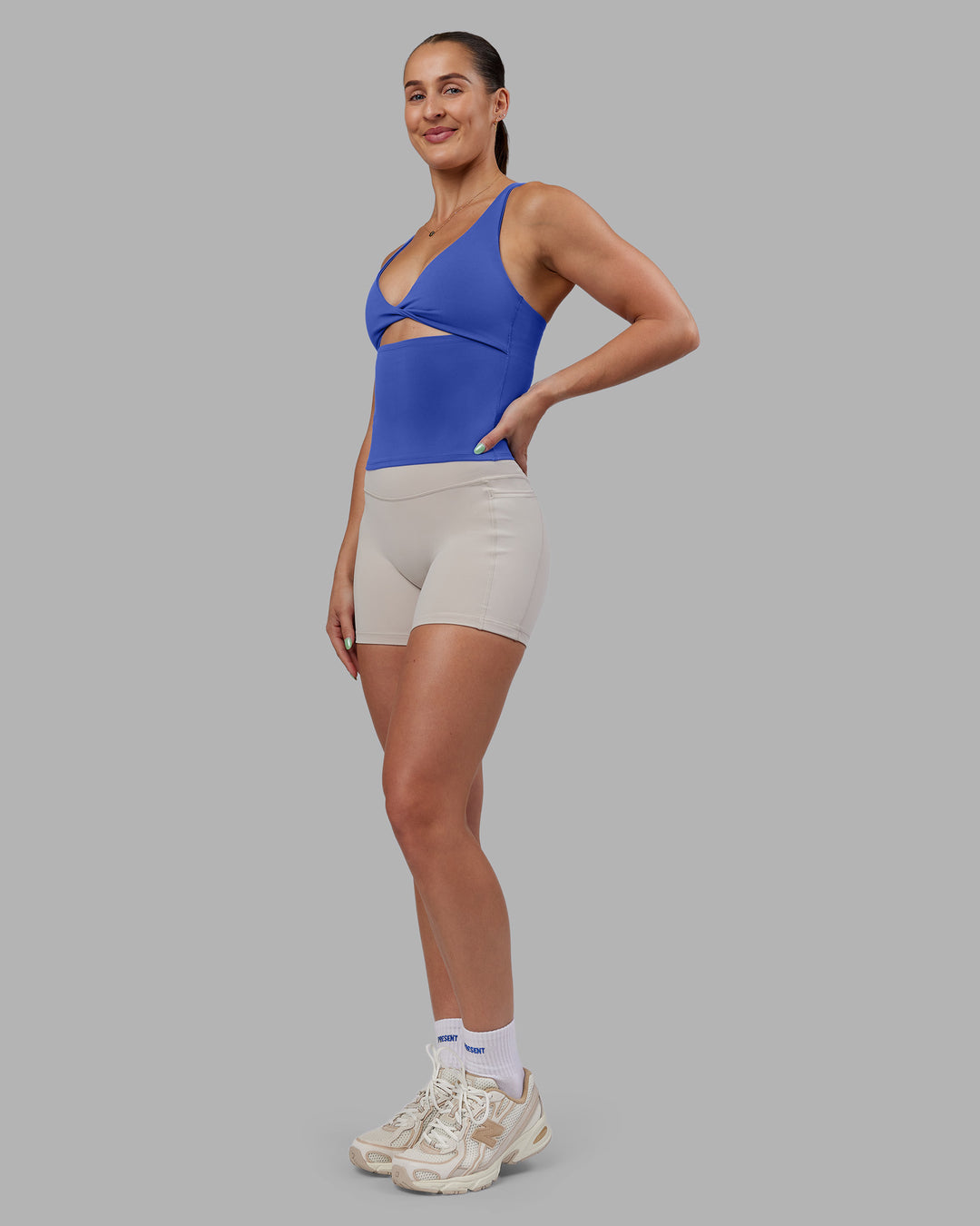 Woman wearing Abs Agile Tank - Power Cobalt | Model:Abbey | Size:M